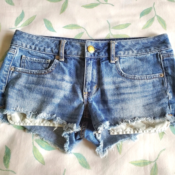 American Eagle High Waist Cut-Off Denim Shorts with Silver Glitter Star Pockets - Picture 2 of 9